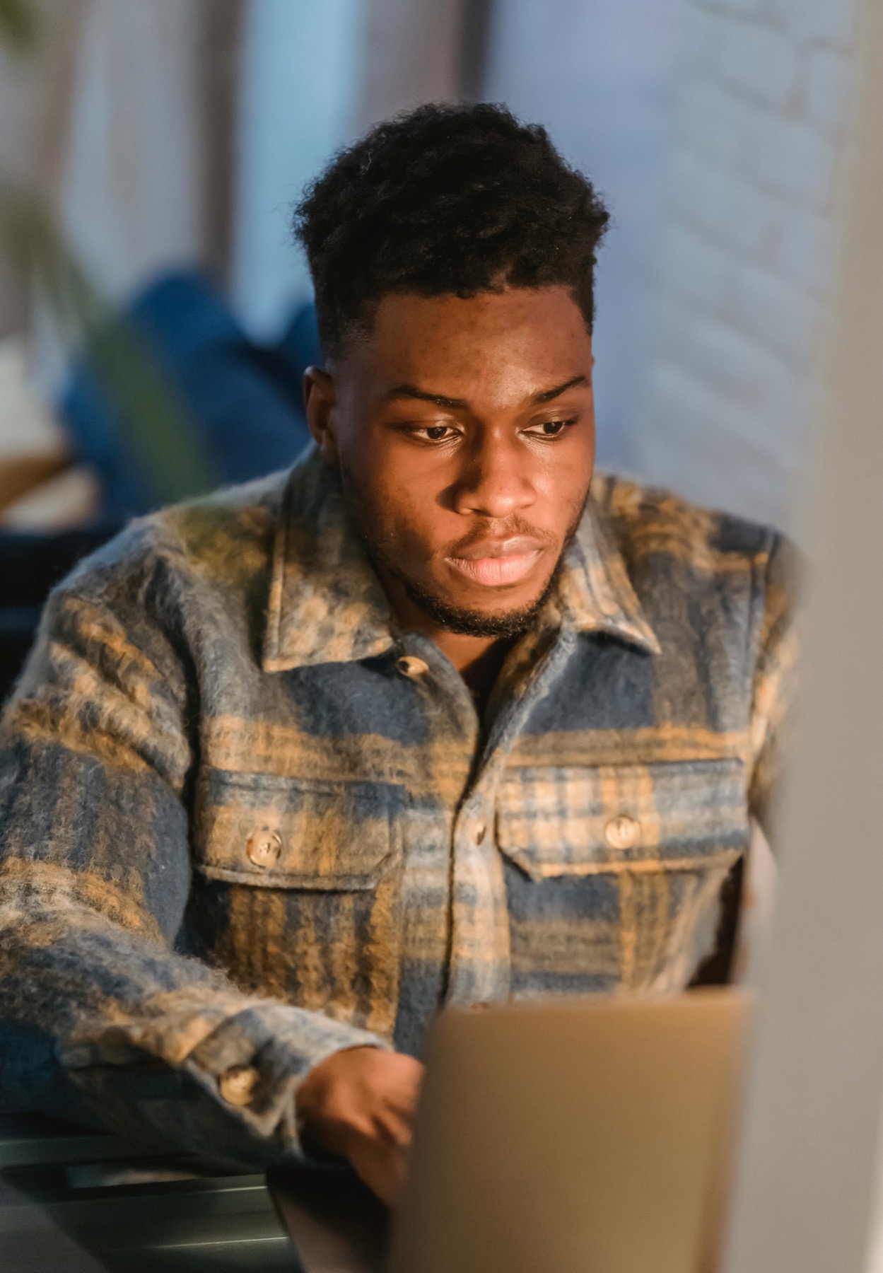 Marketer reviewing campaign work on a laptop